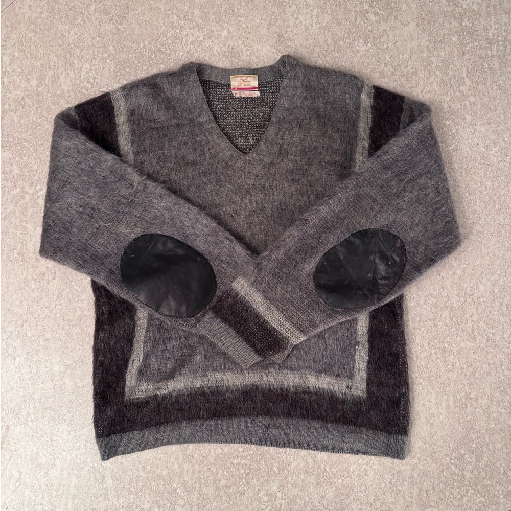Pull in wool and mohair/luxury fabric